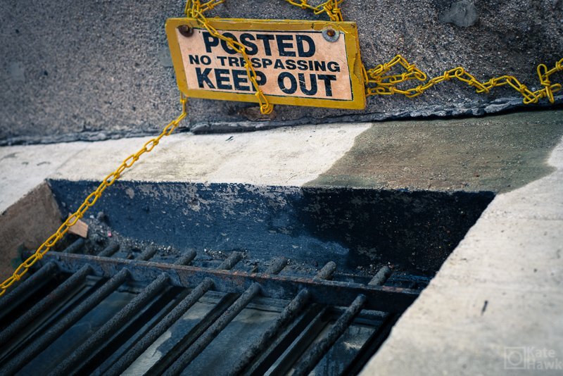 A picture of a no trespassing sign on the ground