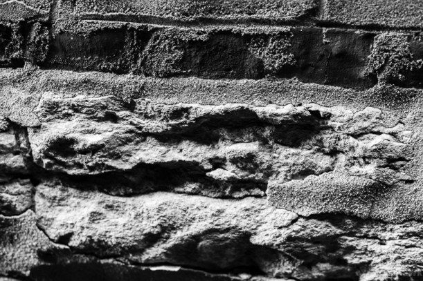 Black and white photo of old granite foundation.