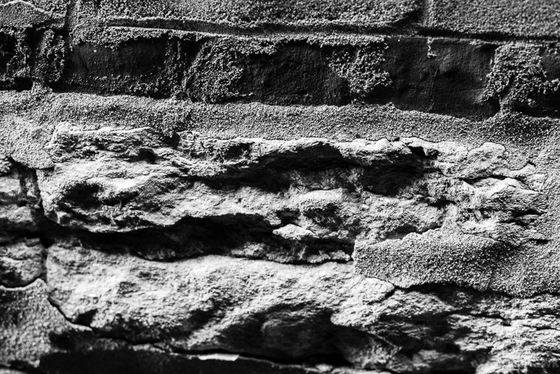 Black and white photo of old granite foundation.