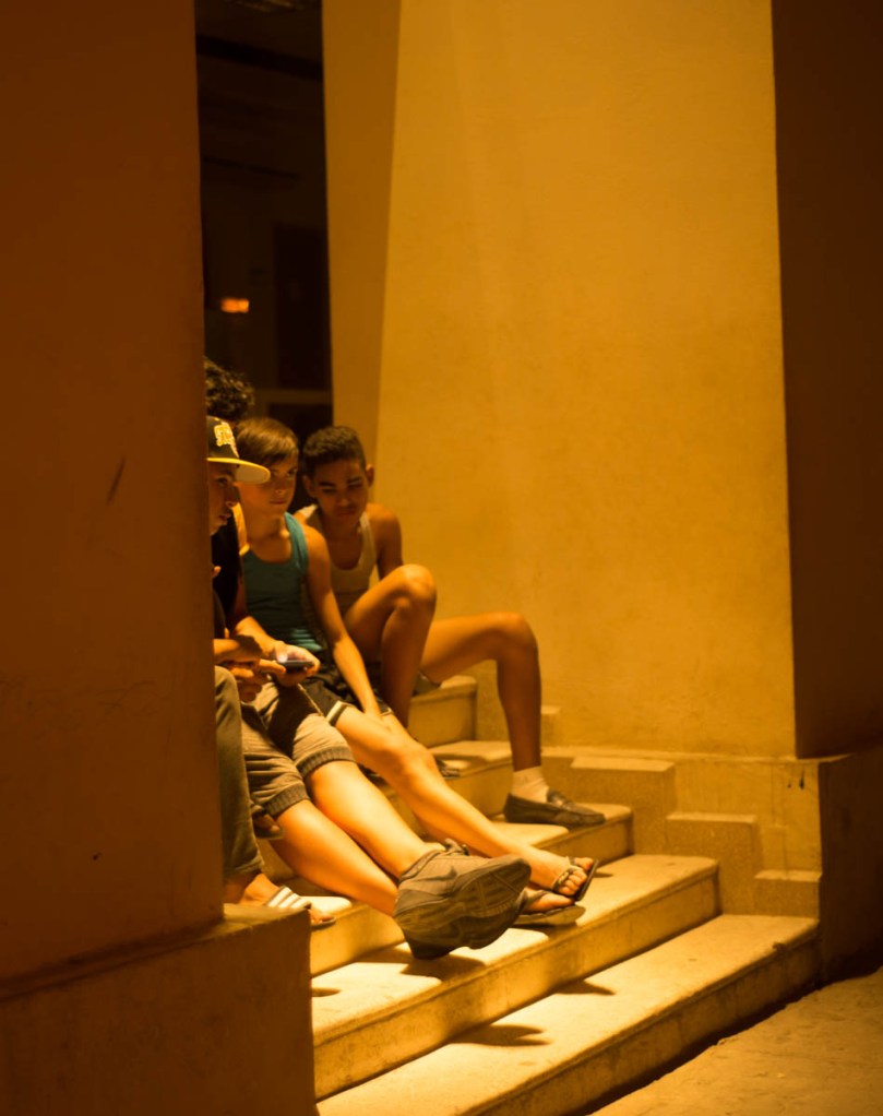 Boys hiding out sharing a video